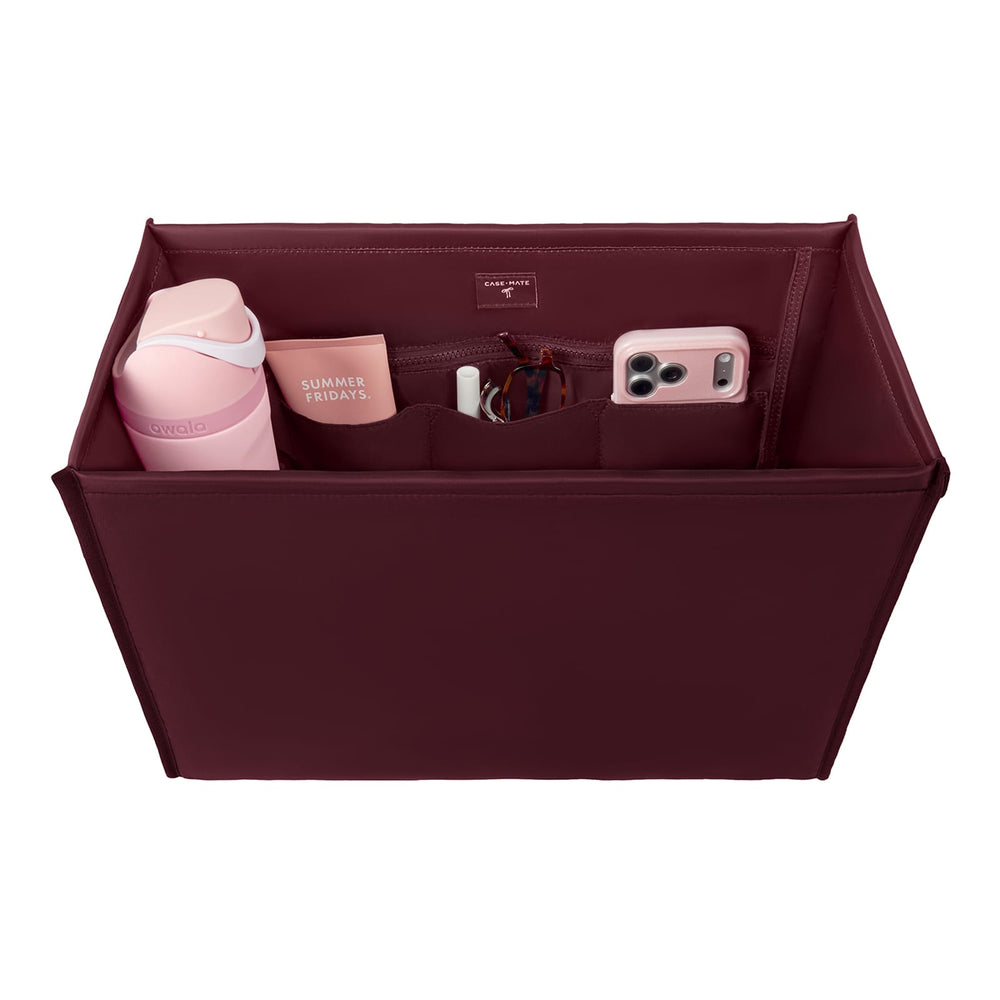 Case-Mate Tote Organizer in burgundy with pink Owala water bottle, Summer Fridays, lip gloss, glasses, and pink iPhone.