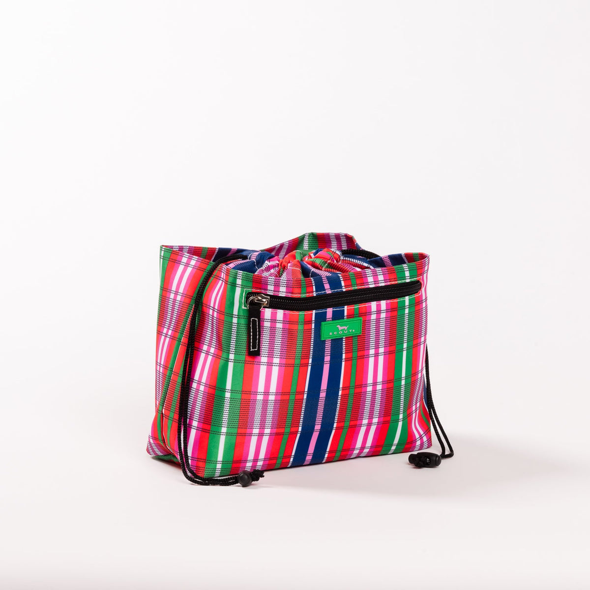 SCOUT Glam Squad Makeup Bag with vibrant pink, red, green, blue, and white plaid pattern and a front zipper pocket.