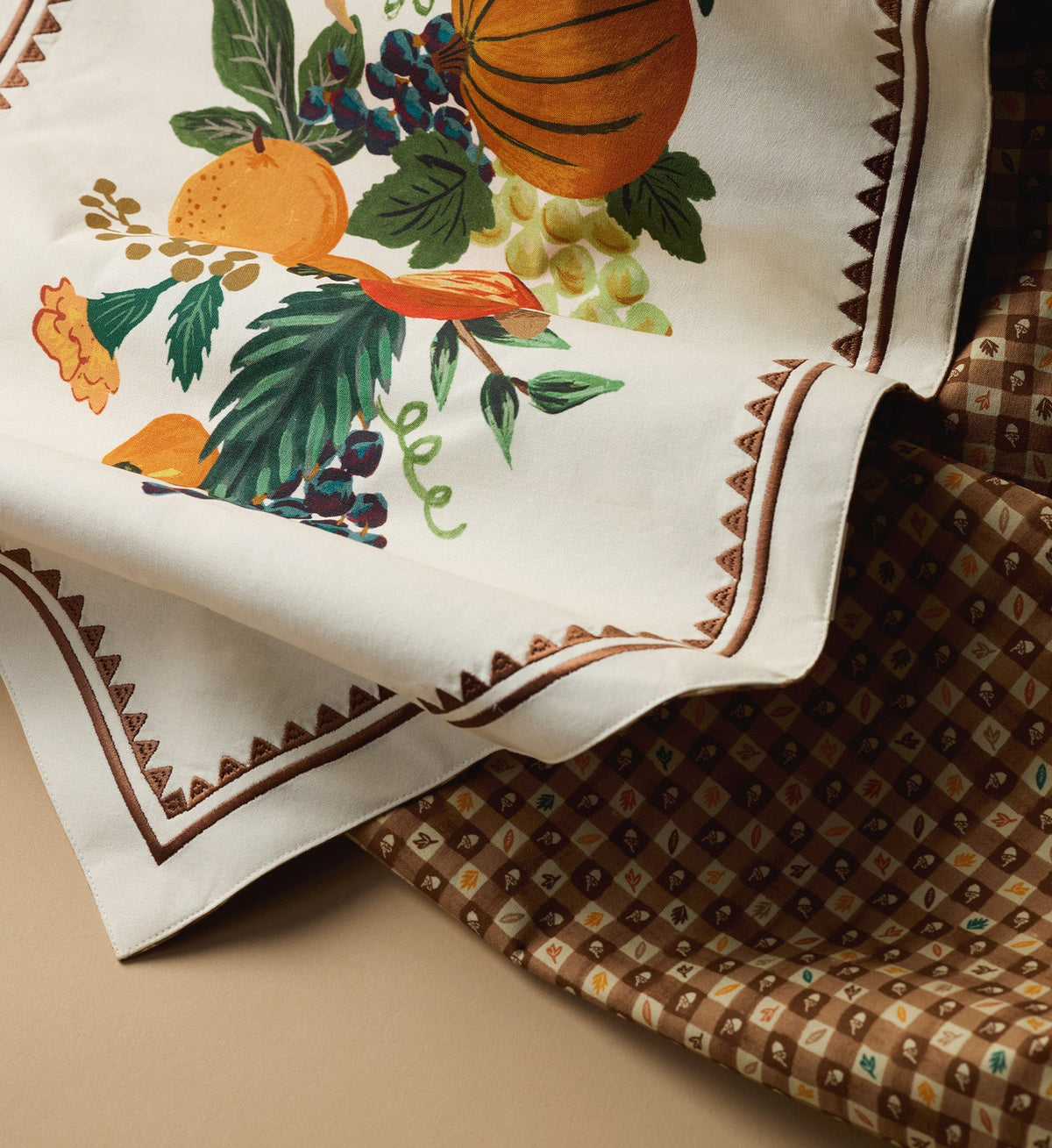 Rifle Paper Co. Harvest Table Runner 16x108, white with fall fruit and pumpkin print, embroidered brown zigzag border.