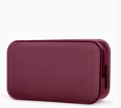 Case-Mate Jelly Makeup Bag in burgundy, a semi-transparent, rectangular cosmetic pouch with a zipper closure.