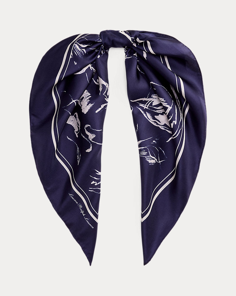 Shiraleah Navy Floral Square Scarf with white abstract floral print, tied at the top.