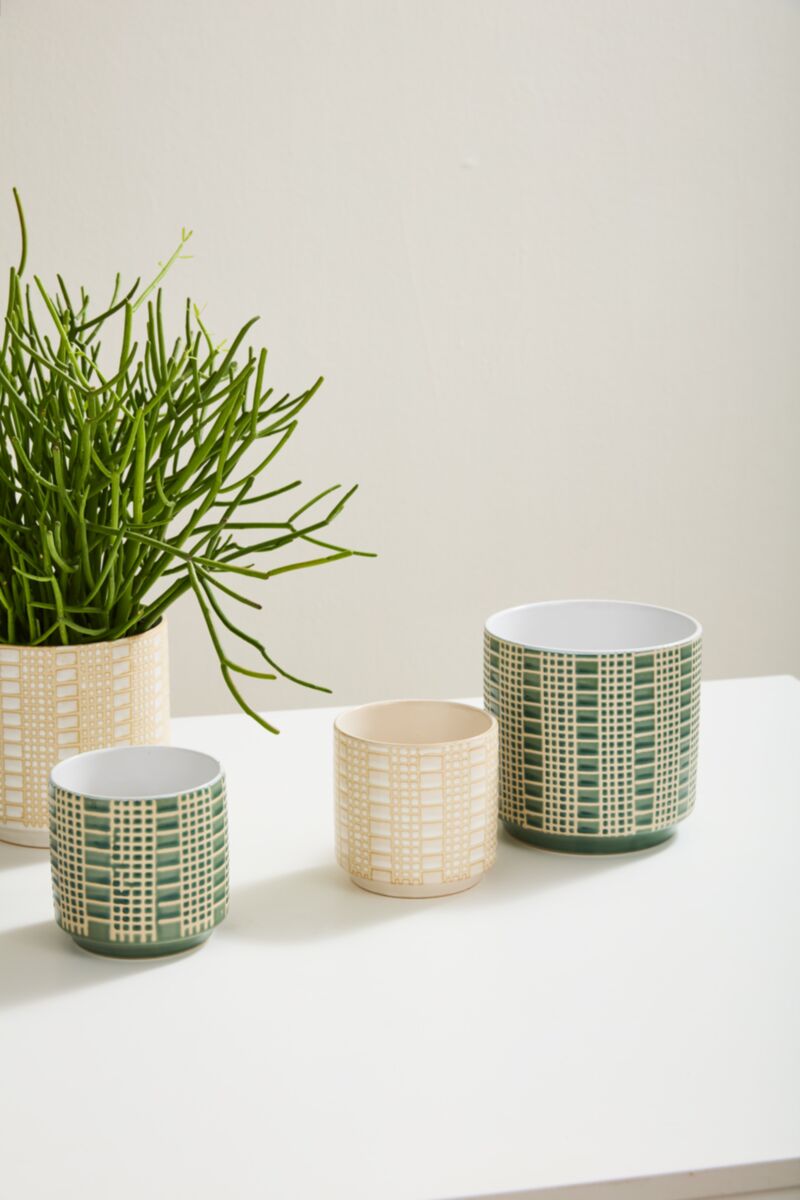 Accent Decor Zati Pot 6.5"x6.75" with a green plant, alongside three other Zati pots in cream and green grid patterns.